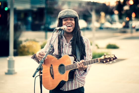 Brian Rogers playing acoustic guitar